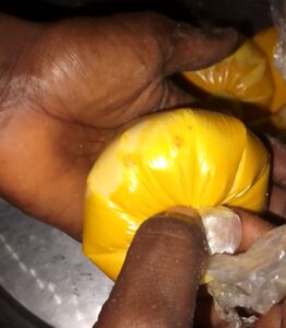 shaking-the-okpa-to-dissolve-the-particles